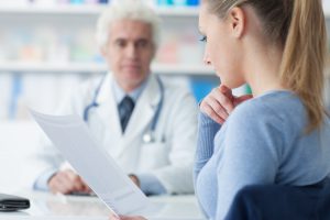 doctor consults with patient