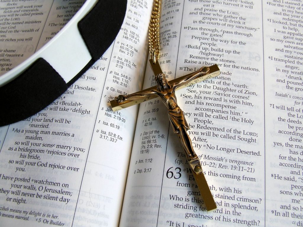 cross and collar on bible