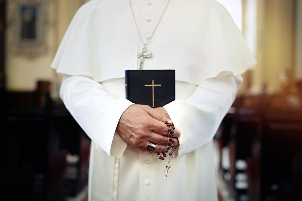 Pope holding a Bible